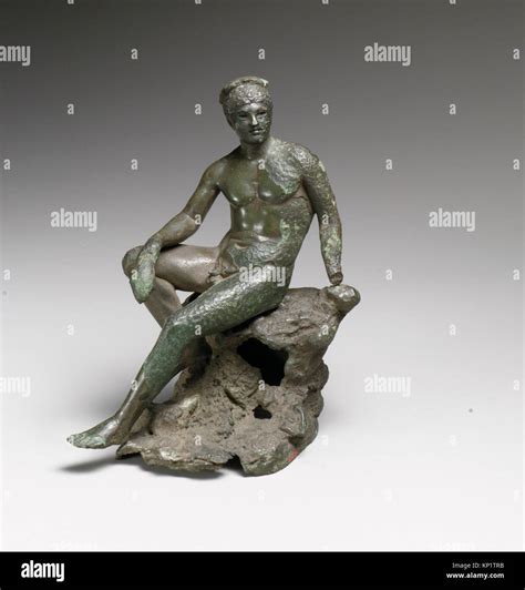 Bronze statuette of Hermes seated on a rock 